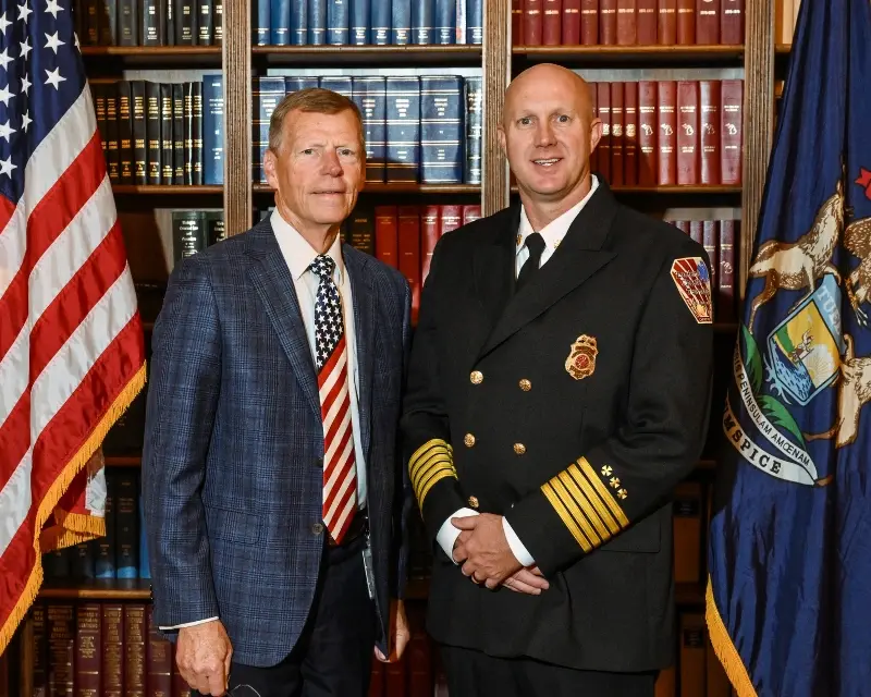 Brad Slagh posing with Zeeland Township Fire Chief, Brock Bruce